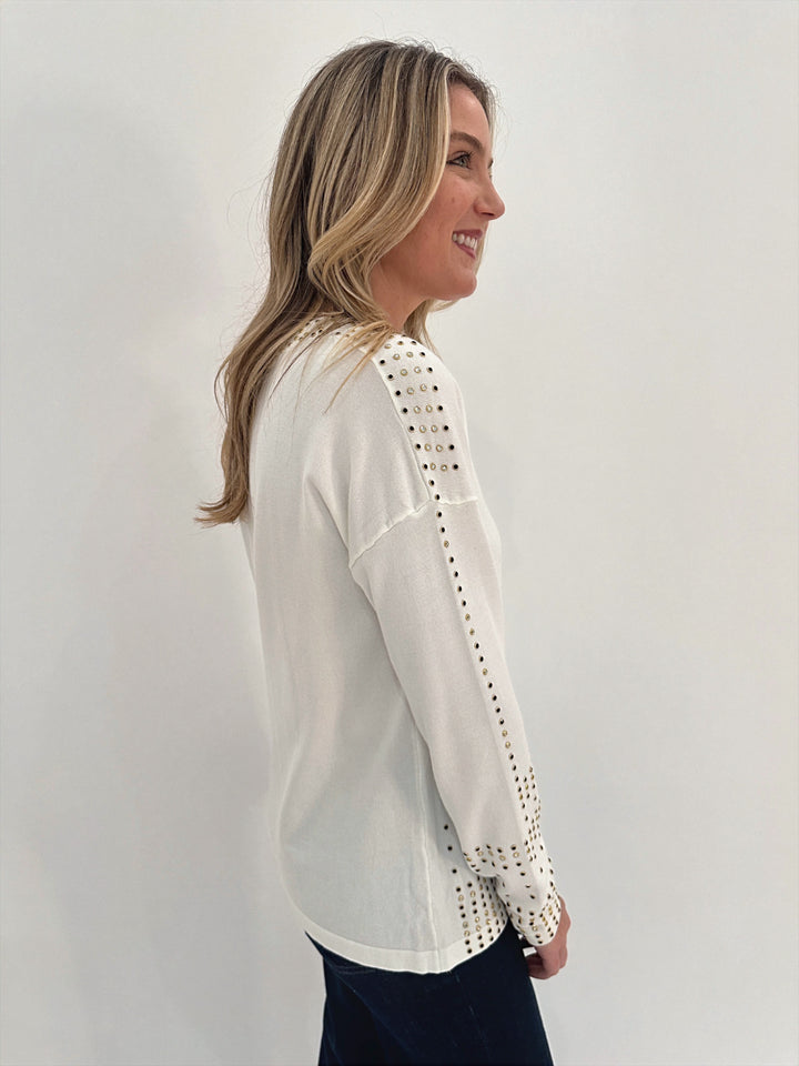 Leo & Ugo V-Neck Rhinestone Grommet Long Sleeve Top in White available at Barbara Katz