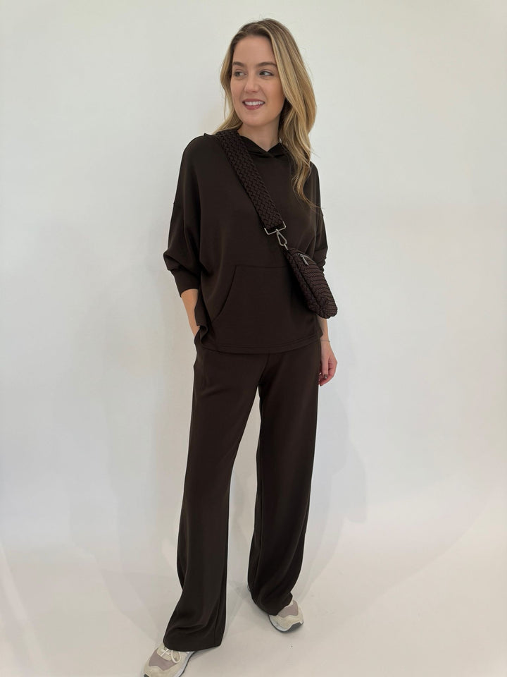 BK Rita Hooded Pullover in Chocolate Brown paired with matching Cindy High-Waist Wide Leg Sweatpants, Sol and Selene Ethereal Woven Neoprene Bag in Chocolate available at Barbara Katz