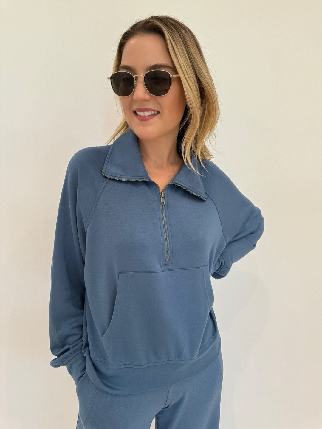 BK Caroline Half Zip-Up Collar Sweatshirt in Gray Blue paired with matching Cindy High-Waist Wide Leg Sweatpants, Le Specs Neptune Deux Sunglasses available at Barbara Katz