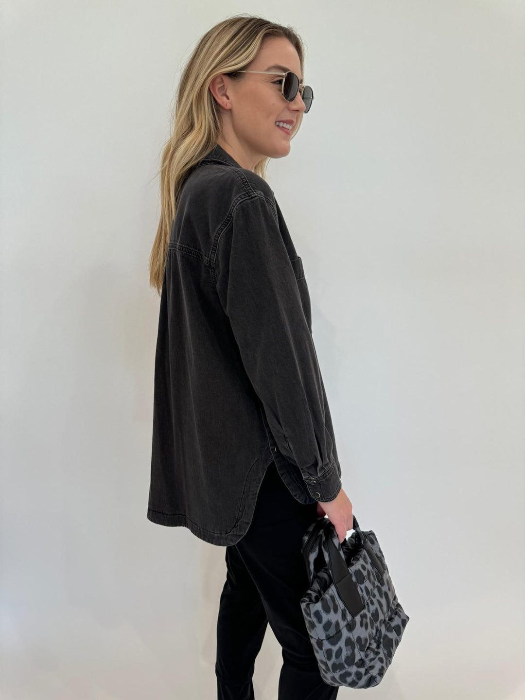 Ba&sh Lexa Long Sleeve Shirt in Blackstone paired with Raffaello Rossie Candy Pants in Black, Le Specs Neptune Deux Sunglasses, Vee Collective Porter Mini Tote Bag in Grey Leopard available at Barbara Katz