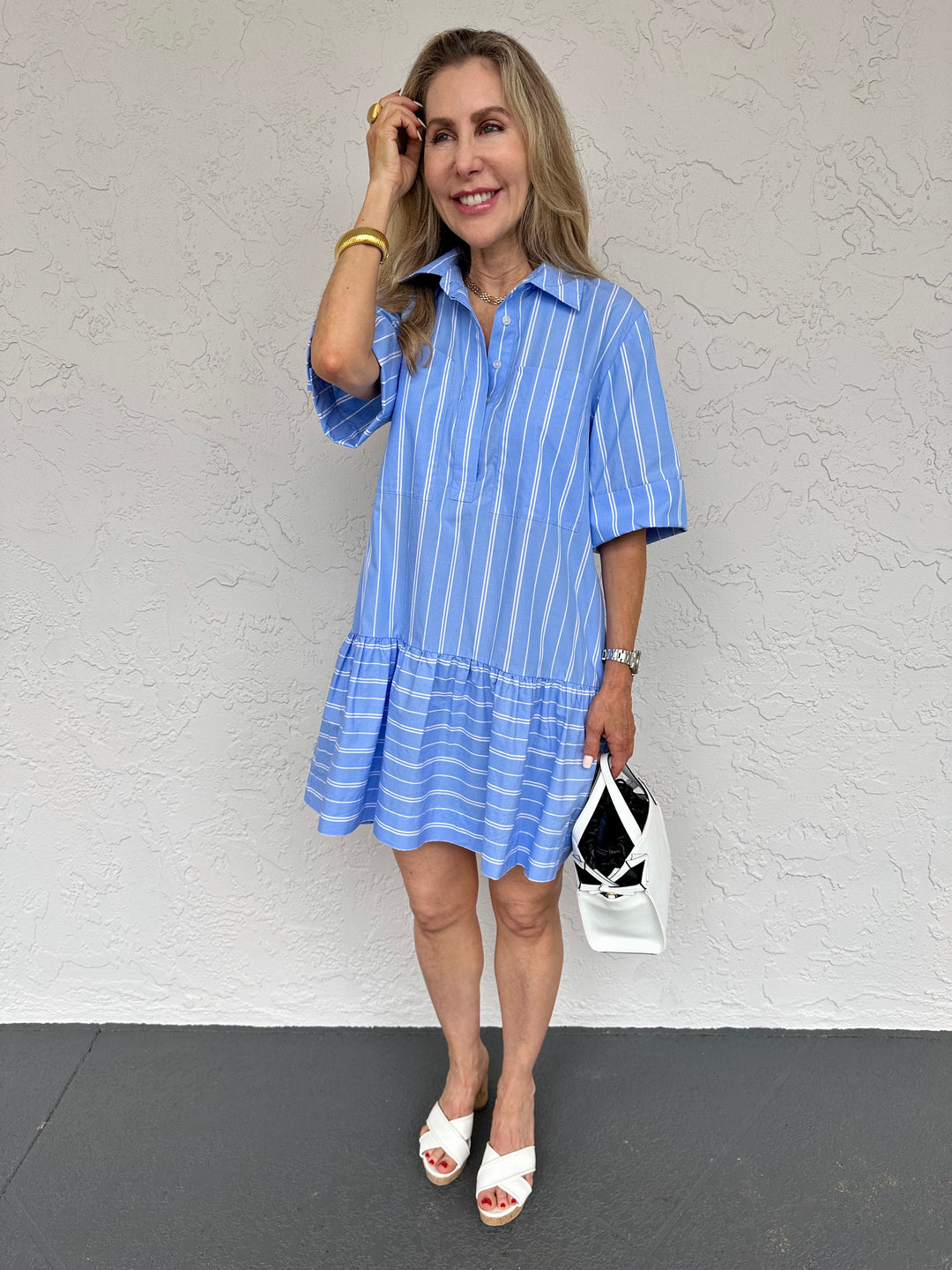 Simkhai Cris Short Sleeve Shirt Dress in Wide Oxford Blue Stripe,  collared dress made from 100% cotton with button-front closure, chest pockets, elbow-length sleeves, and flounce hem