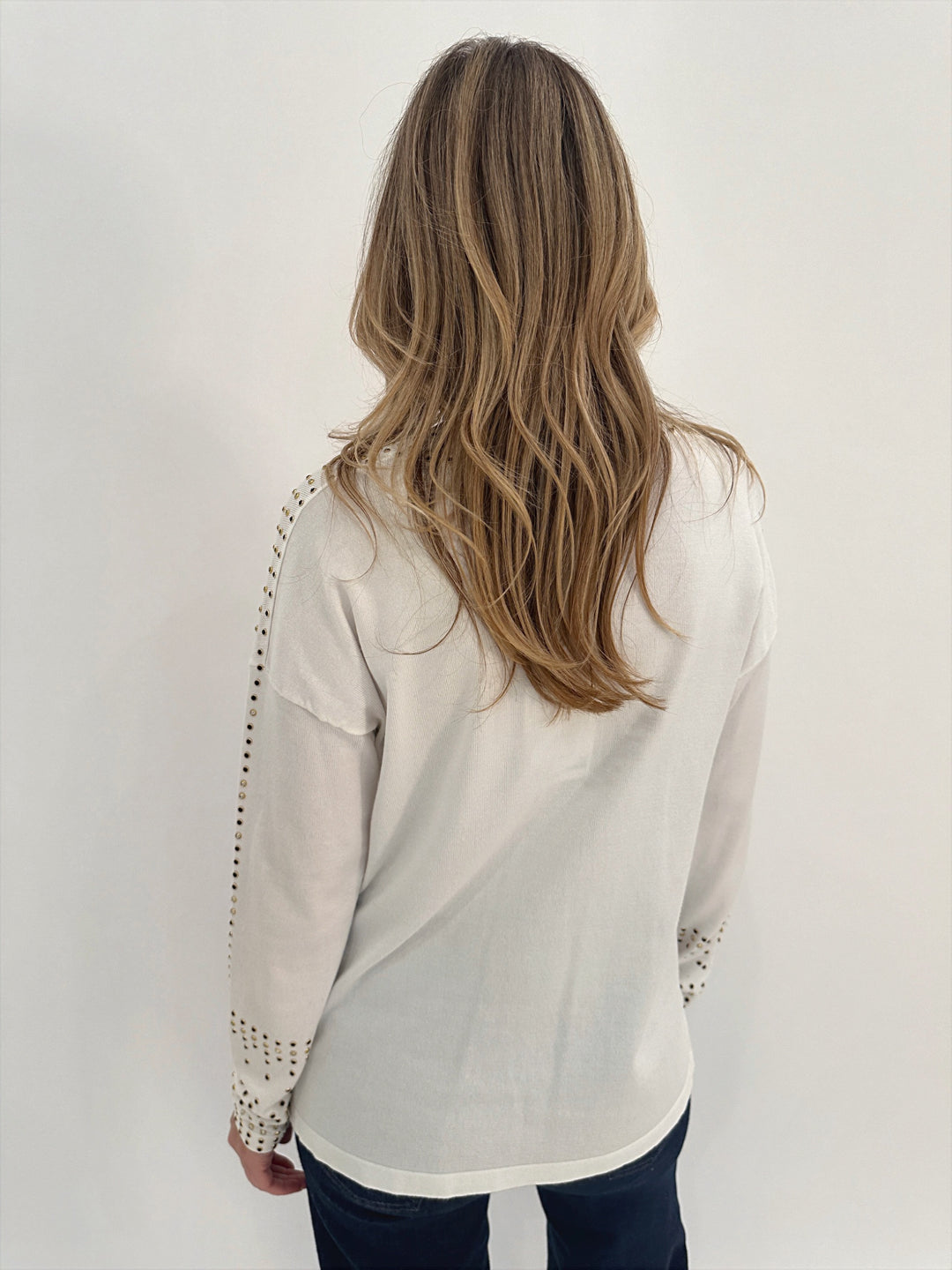 Leo & Ugo Rhinestone Grommet Long Sleeve V-neck Top in White available at Barbara Katz