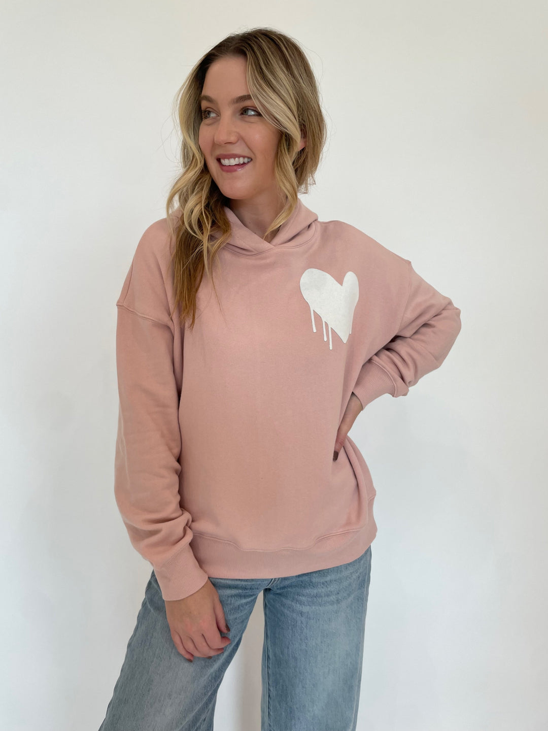 Kerri Rosenthal Boyfriend Drippy Heart Hoodie Unisex in Mauve paired with Pistola Ryder Cuffed Jeans in Essex available at Barbara Katz