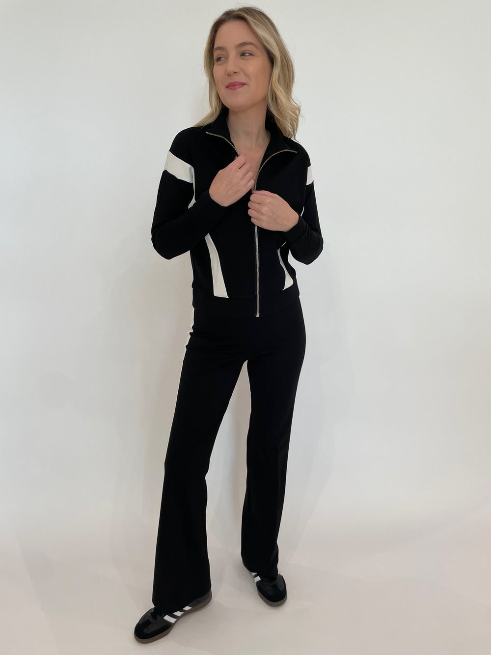 Peace of Cloth Vicki Zip-Up Jacket in Black paired with matching Reese Paramount Knit Pants in Black available at Barbara Katz