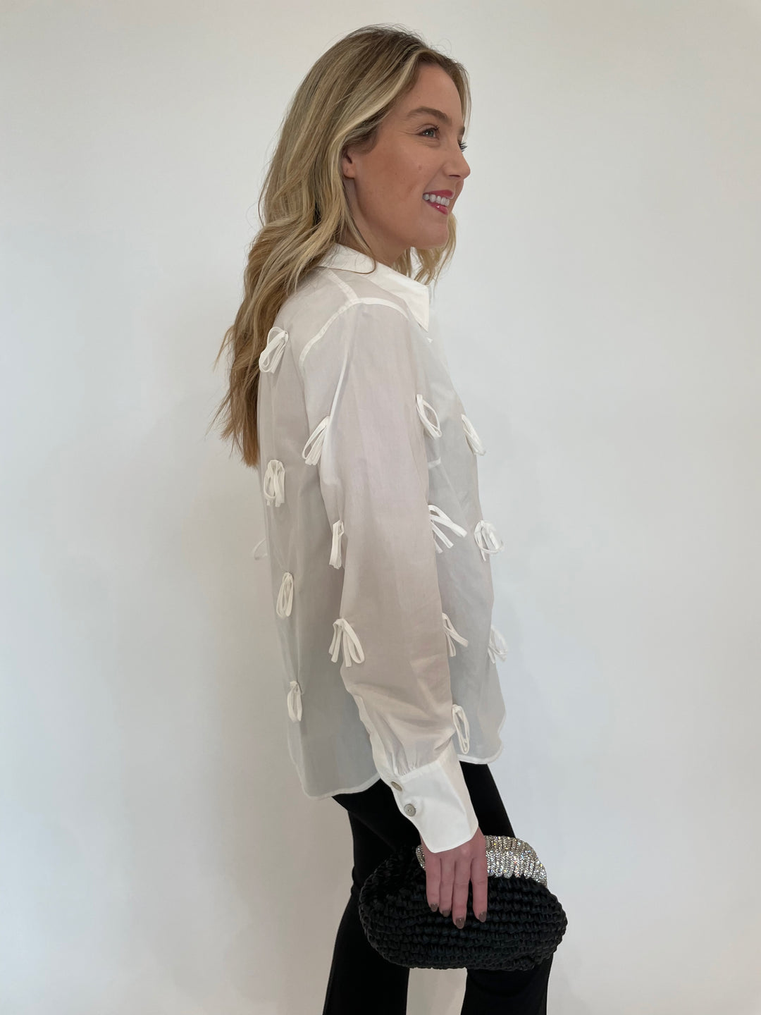 Hope For Flowers Bow Button Down Long Sleeve Shirt in White with Noam Hazan Metallic Desor Clutch in Black available at Barbara Katz