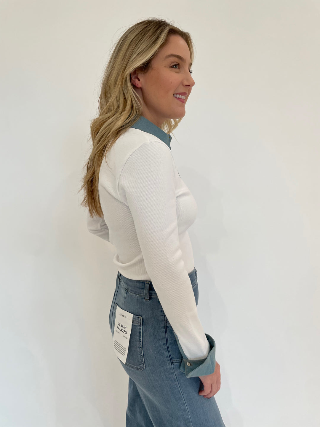 Cinq a Sept Denim Jaden Long Sleeve Top in White paired with Frame Le Slim Palazzo Bardot Pocket Jeans in Wilson Clean available at Barbara Katz