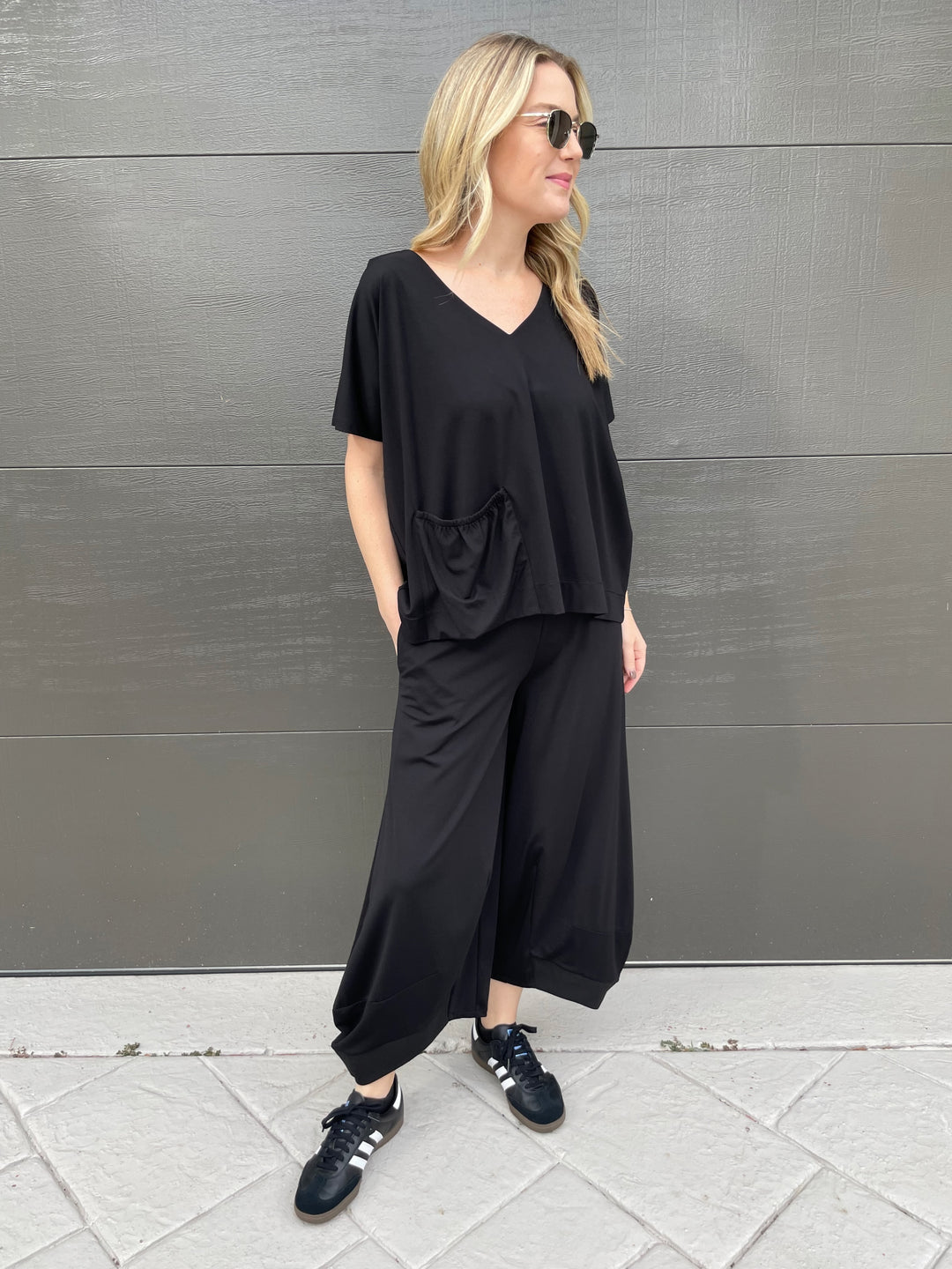 Ozai N Ku Ava V-Neck Pocket Top in Black paired with matching Ozai N Ku Lantern Pants in Black available at Barbara Katz