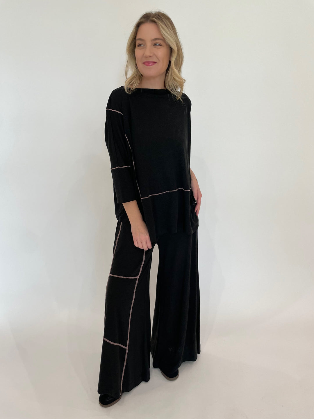 Ozai N Ku Kira Wide Leg Contrast Stitch Pants in Black/Pink paired with matching Lira 3/4 Sleeve Contrast Stitch Top available at Barbara Katz