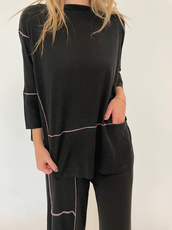 Ozai N Ku Lira 3/4 Sleeve Contrast Stitch Top in Black/Pink paired with matching Kira Contrast Stitch Pants available at Barbara Katz