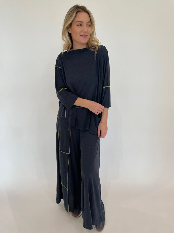 Ozai N Ku Lira 3/4 Sleeve Contrast Stitch Top in Blue/Yellow paired with matching Kira Wide Leg Contrast Stitch Pants available at Barbara Katz