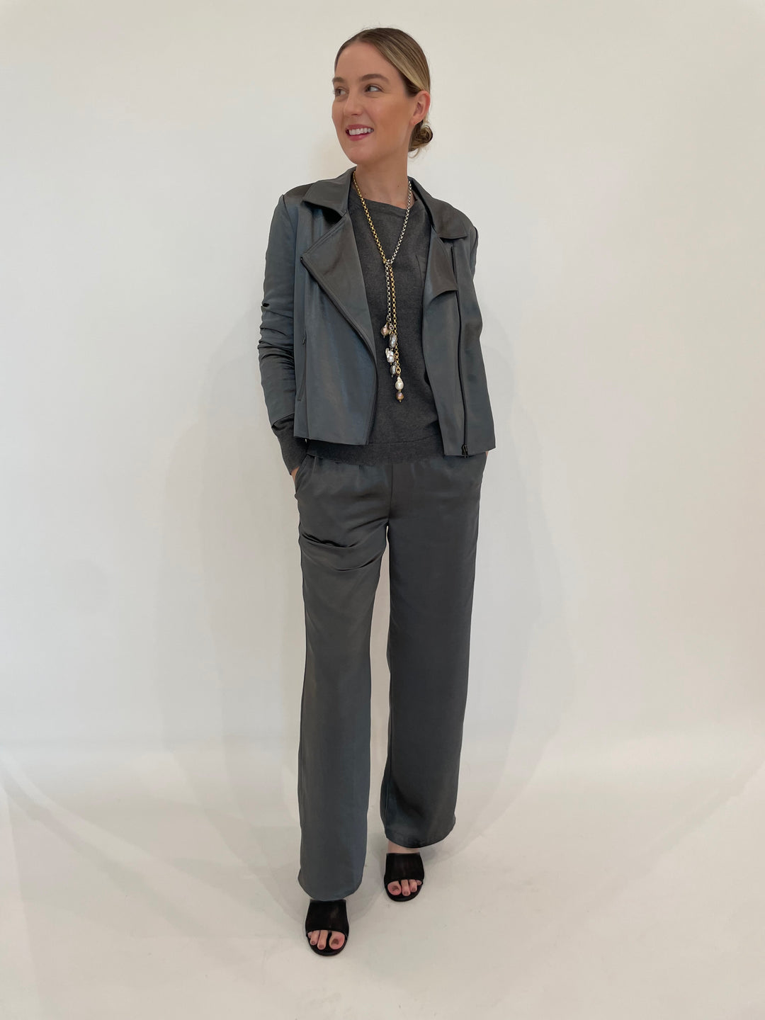 J Society Jesse Satin Pants in Gunmetal paired with matching J Society Jette Satin Pocket Sweatshirt and Raven Ruched Sleeve Moto Jacket in Gunmetal, Suzy T Pearl Lariat Necklace in Gold/Silver available at Barbara Katz