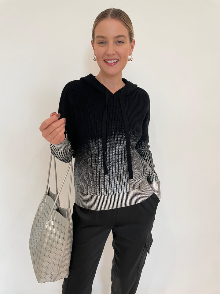 J Society Metallic Ombre Shaker Hoodie in Black paired with J Society Satin Cargo Pants in Black, Lizzie Fortunato Onda Hoops in Silver, BK Victoria Medium Tote Bag in Silver available at Barbara Katz