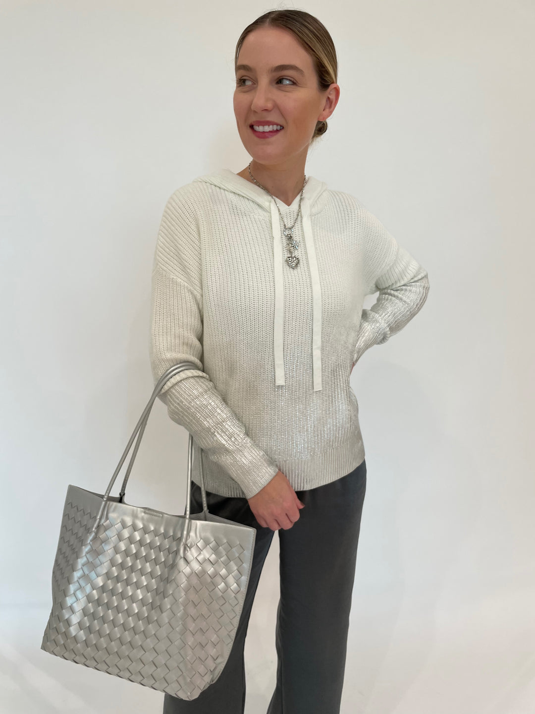 J Society Metallic Ombre Shaker Hoodie in Vanilla paired with J Society Satin Pants in Gunmetal, Elizabeth Cole Jewelry Cerelia Necklace in Silver, , BK Victoria Medium Tote Bag in Silver available at Barbara Katz