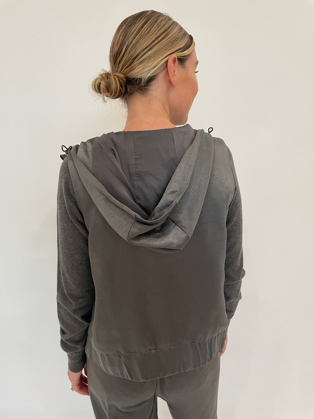 J Society Celeste Satin Hoodie Vest in Gunmetal with Jette Satin Pocket Sweatshirt underneath available at Barbara Katz