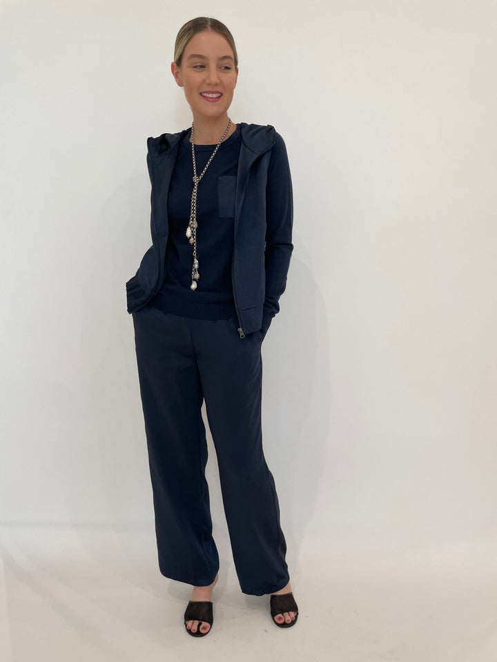 J Society Jesse Satin Pants in Navy paired with matching J Society Jette Satin Pocket Sweatshirt and Celeste Satin Hoodie Vest in Navy, Suzy T Pearl Lariat Necklace in Antique Silver available at Barbara Katz