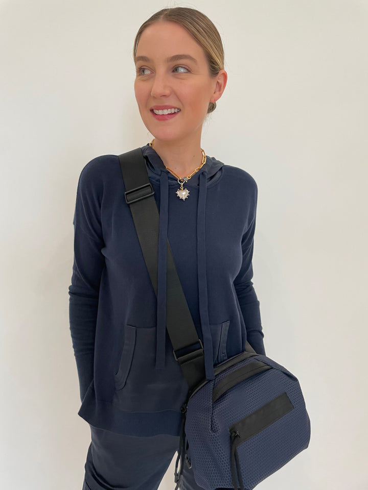 J Society Roxie Satin Pocket Hoodie in Navy with Elizabeth Cole Jewelry Meira Necklace, Daniella Lehavi Bonnie Crossbody Bag in Navy available at Barbara Katz