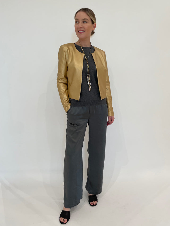 J Society Gold Metallic Collarless Jacket with J Society Gunmetal Satin Pocket Sweatshirt underneath, paired with J Society Gunmetal Satin Pants, Suzy T Pearl Lariat Necklace in Gold/Silver available at Barbara Katz