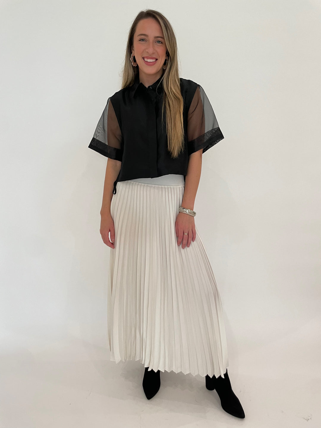 Simkhai Ryett Short Sleeve Crop Shirt in Black paired with Simkhai Valor Midi Skirt in Ivory, BK Silver Cobra Cuff and July Hammered Wavy Metal Hoop Earrings in Worn Silver - all available at Barbara Katz