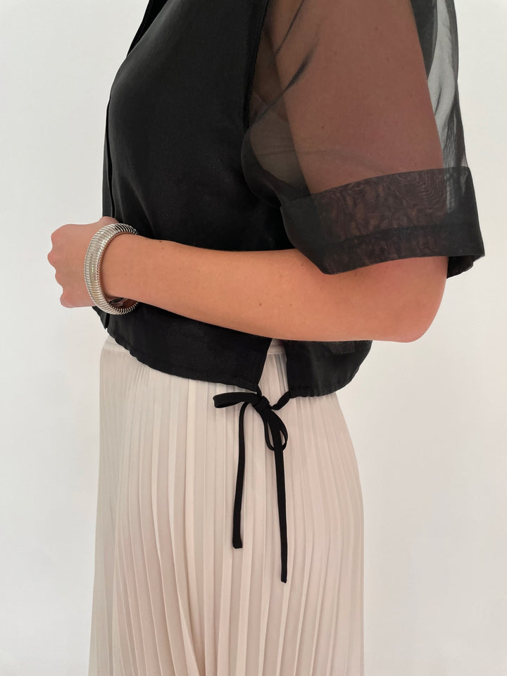 Simkhai Ryett Short Sleeve Crop Shirt in Black paired with Simkhai Valor Midi Skirt in Ivory, BK Silver Cobra Bracelet and July Hammered Wavy Metal Hoop Earrings in Worn Silver - all available at Barbara Katz