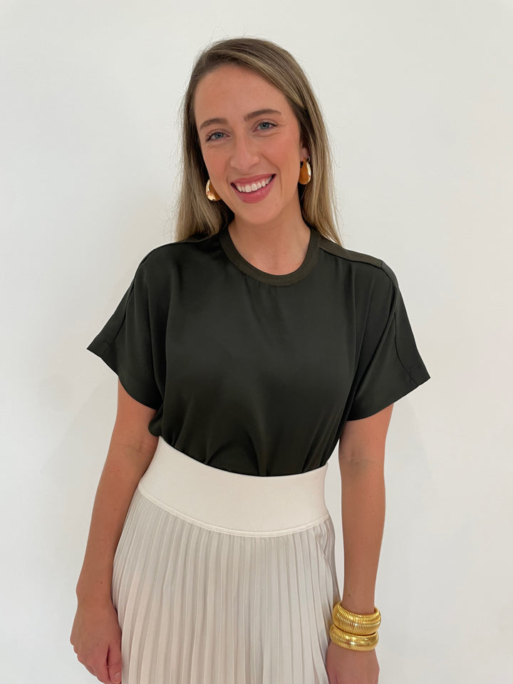 Simkhai Addy T- Shirt in Moss paired with Valor Midi Skirt in Ivory, BK Cobra Cuff and Bracelet, BK Bianca Puffy Triangle Open Hoop Earrings - all available at Barbara Katz