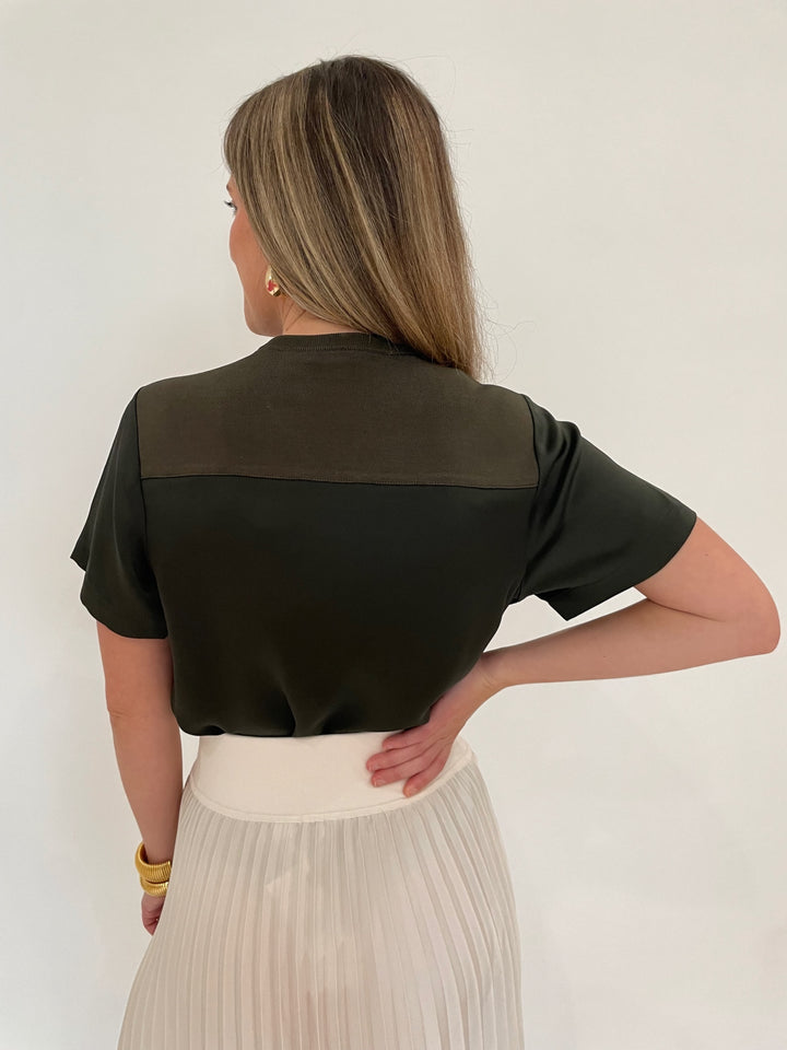 Simkhai Addy Short Sleeve Knit Back Tee in Moss paired with Valor Midi Skirt in Ivory, BK Cobra Cuff and Bracelet, BK Bianca Puffy Triangle Open Hoop Earrings - all available at Barbara Katz