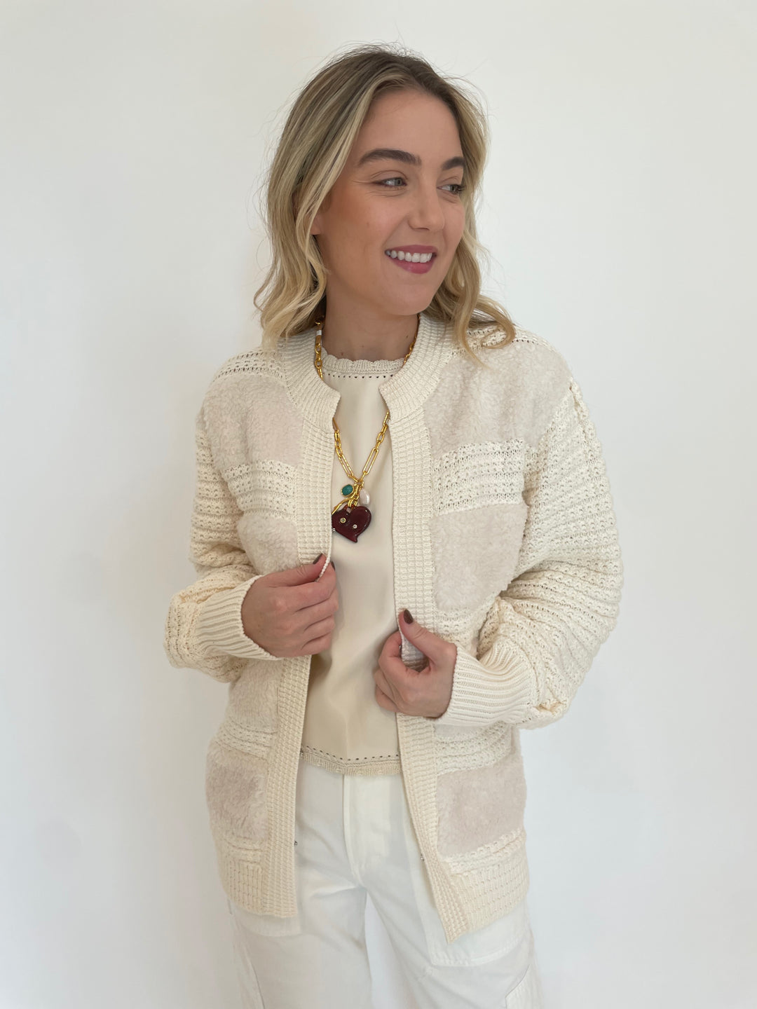 Melissa Nepton Cece Vegan Leather Sleeveless Top in Cream layered with Romeo Fuzzy Crochet Cardigan in Cream, Lizzie Fortunato Murano Heart Necklace available at Barbara Katz