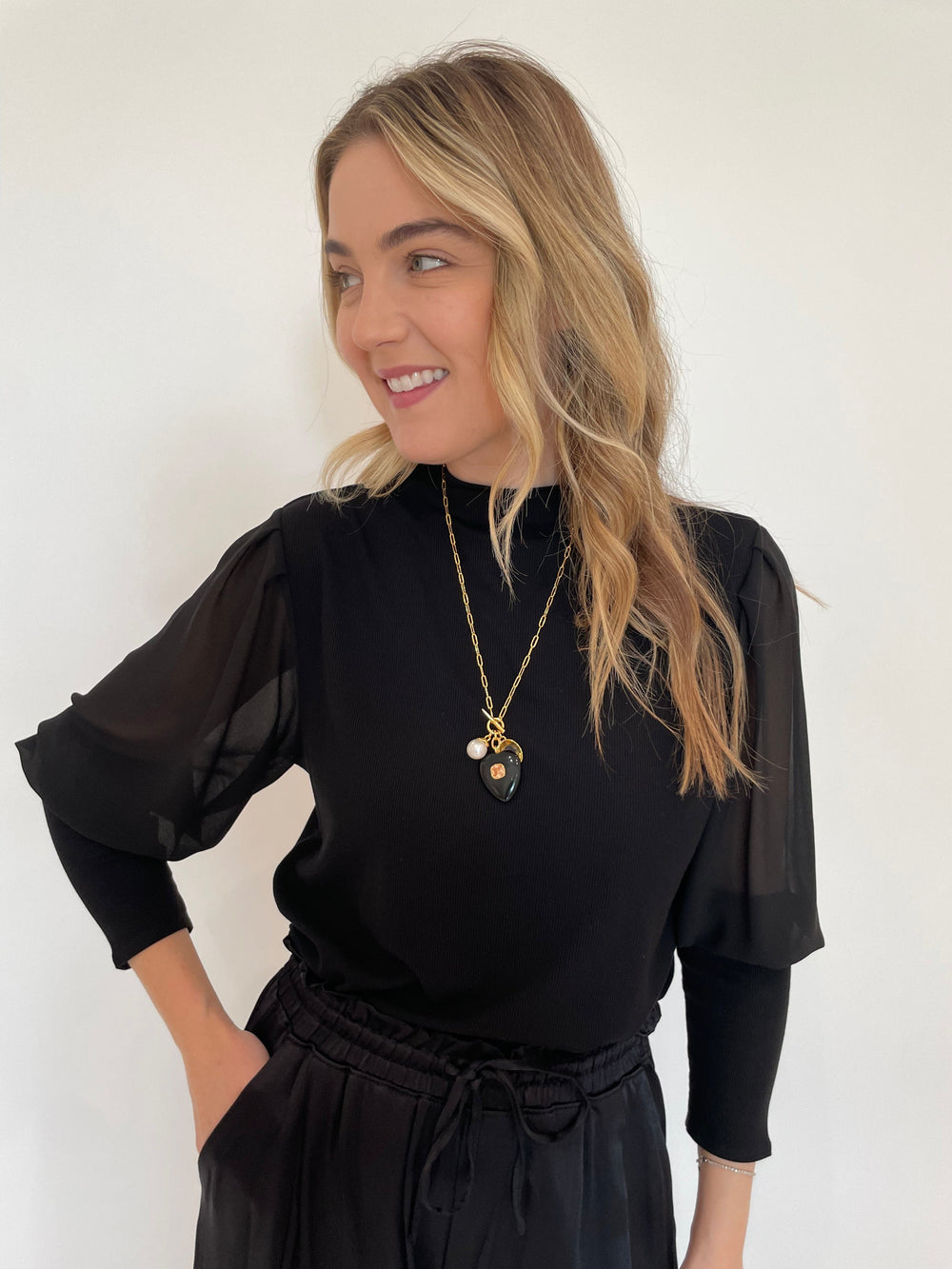 Melissa Nepton Melody Sheer Sleeve Top in Black with Lizzie Fortunato Eugenia Heart Lariat Necklace available at Barbara Katz