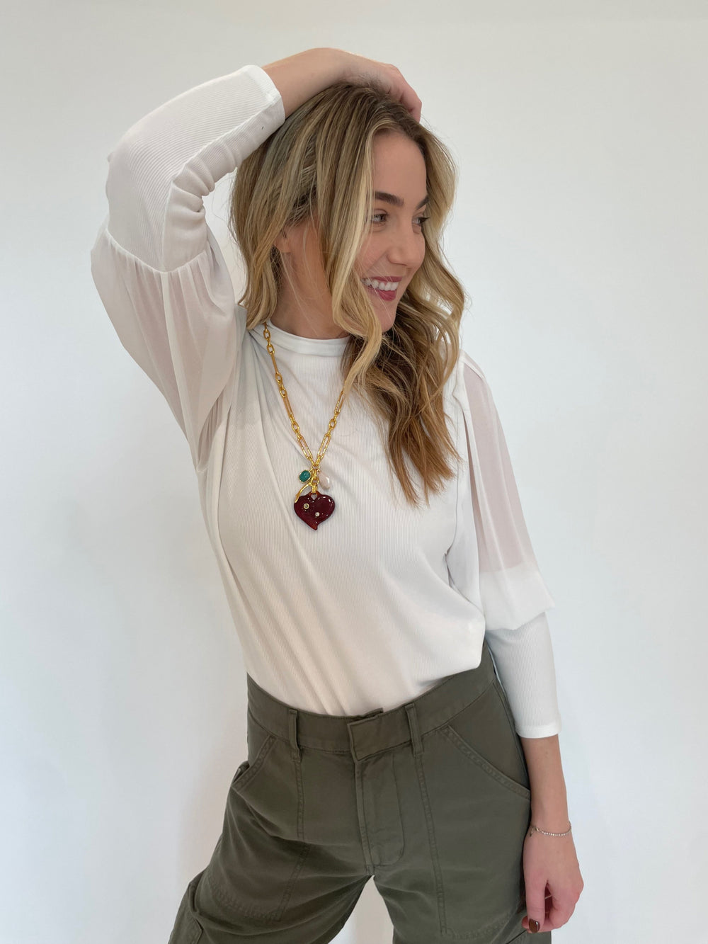 Melissa Nepton Melody Sheer Sleeve Top in Off White paired with Citizens of Humanity Marcelle Low Slung Easy Cargo Pants in Dogwood, Lizzie Fortunato Murano Heart Necklace - all available at Barbara Katz