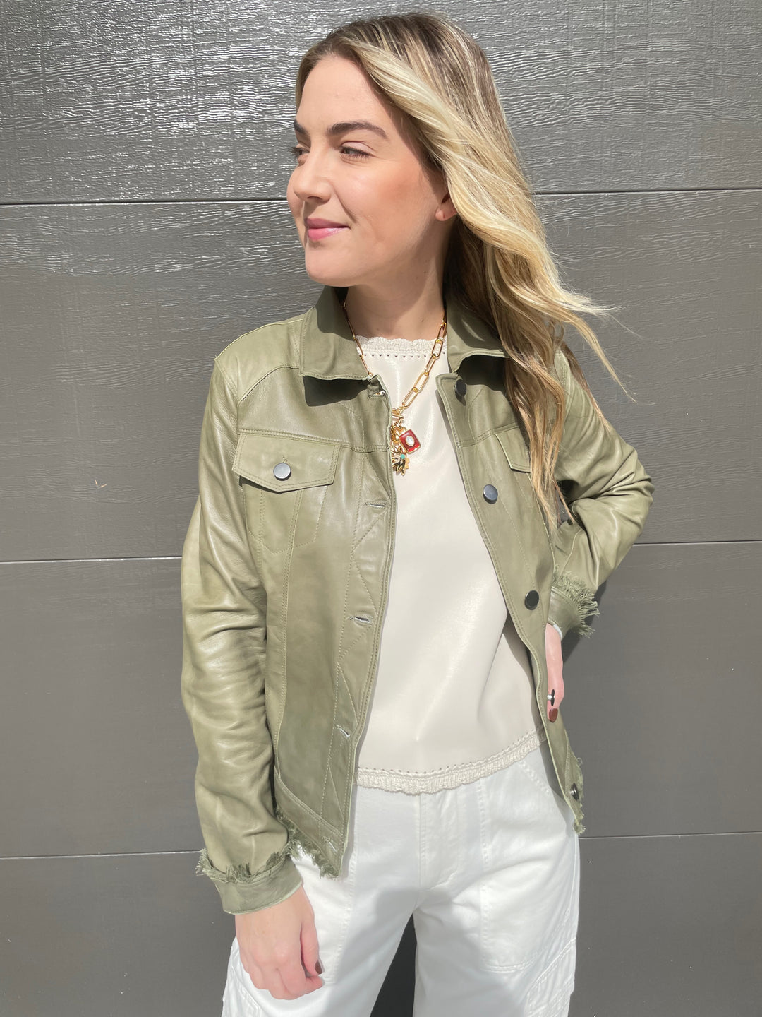 Jakett Alexa Patina Leather Jacket in Army with Melissa Nepton Cream Cece Vegan Leather Sleeveless Top underneath, paired with Citizens of Humanity Marcelle Low Slung Easy Cargo Pants in Pashmina, Lizzie Fortunato Helios Charm Necklace available at Barbara Katz