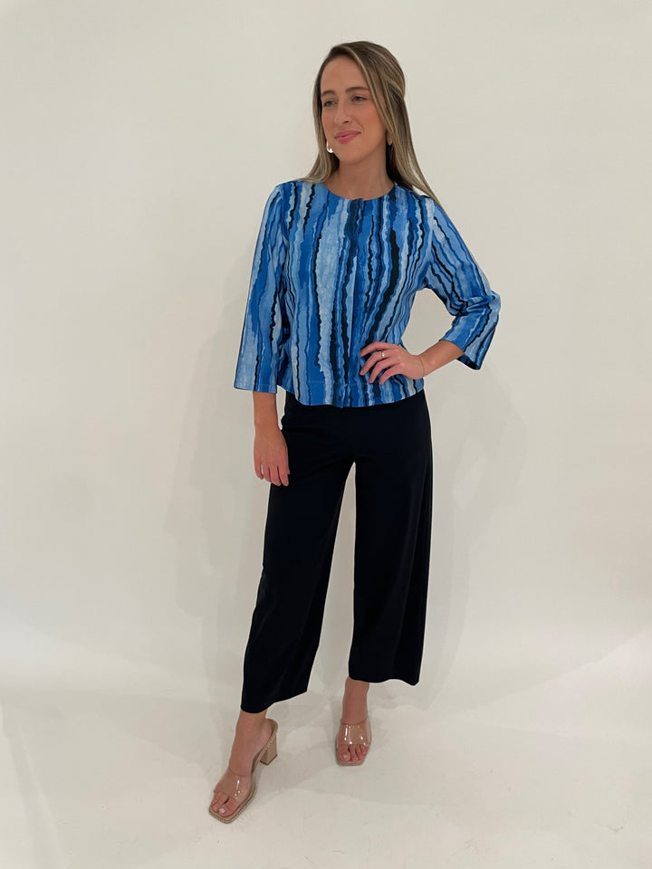 Pashma Contoured Lines Jacket in Blue paired with Raffaello Rossi 7/8 Sally Pants in Marine, BK Bianca Puffy Triangle Open Hoop Earrings in Silver - all available at Barbara Katz