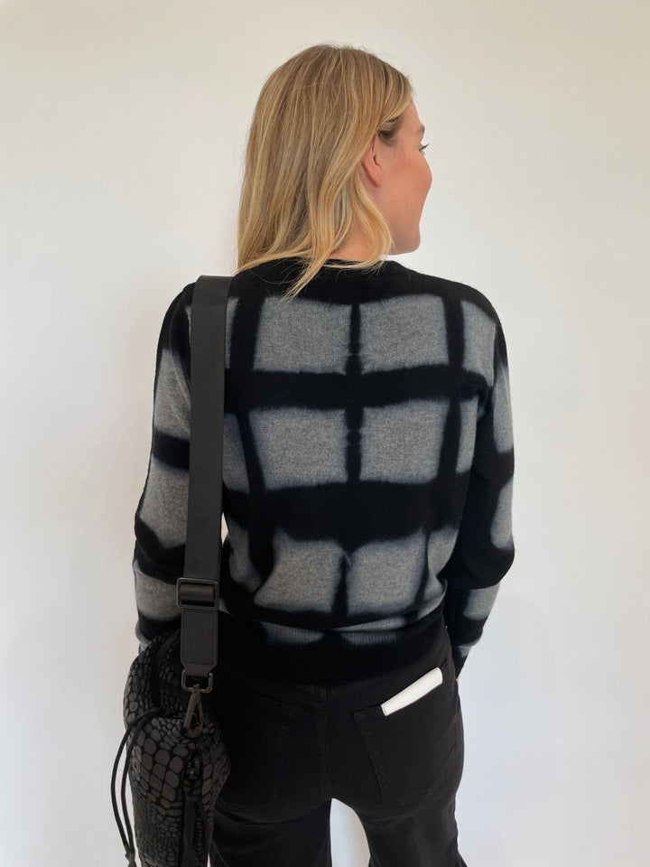 Autumn Cashmere Shibori Plaid Crew Sweater in Cement paired with Frame Le Slim Palazzo Wide Leg Jeans in Black, Daniella Lehavi Tokyo Crossbody Bag in Black available at Barbara Katz