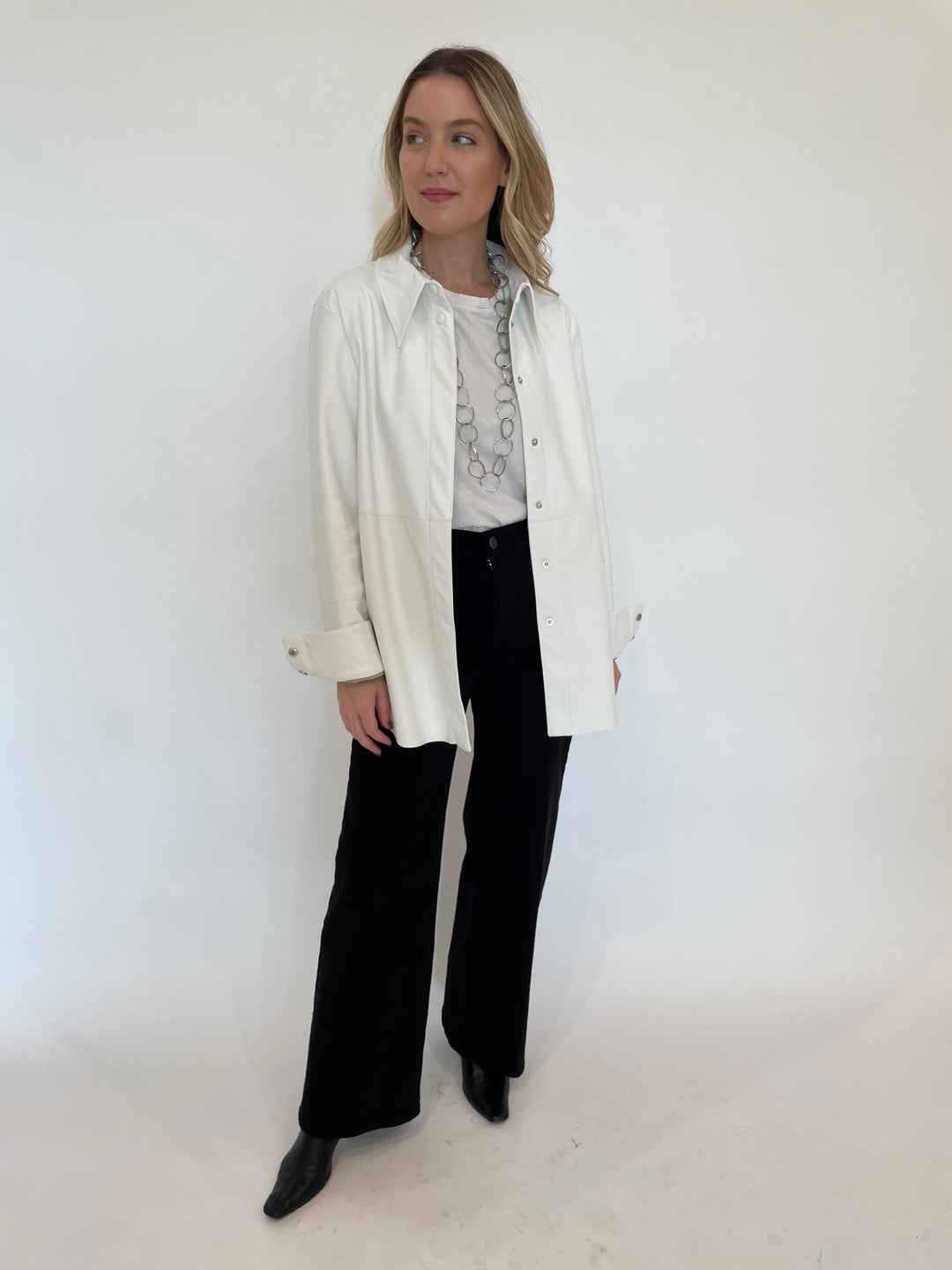 BK Julia Metallic Vegan Leather Shacket in White paired with Frame Le Slim Palazzo Wide Leg Jeans in Black available at Barbara Katz