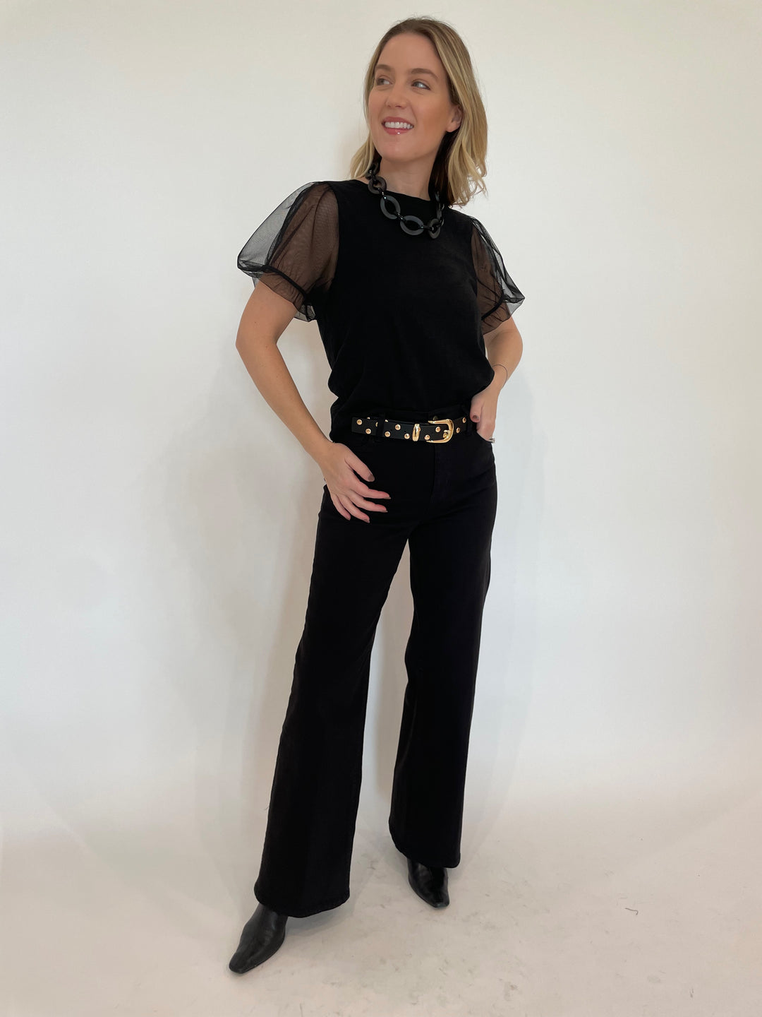 Goldie Tulle Princess Sleeve Tee in Black paired with Frame Le Slim Palazzo Wide Leg Jeans in Black, Pono Linda Barile Necklace in Matte Black, B-Low the Belt Juniper Studded Leather Belt in Black Gold available at Barbara Katz