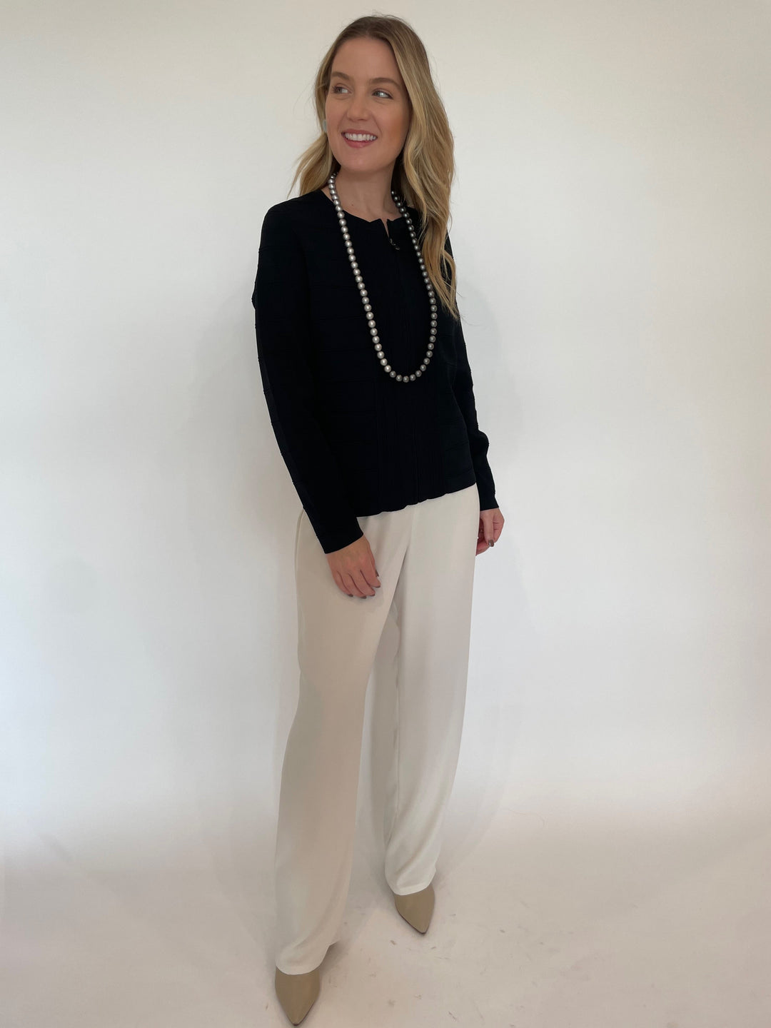 BK Juliet Zip-Front Knit Jacket in Black paired with Peace of Cloth Jules Paramount Knit Pants in Osyter, Pono Mollie Barile Clip Earrings in Silver and Pono Pauline Necklace in Chrome available at Barbara Katz