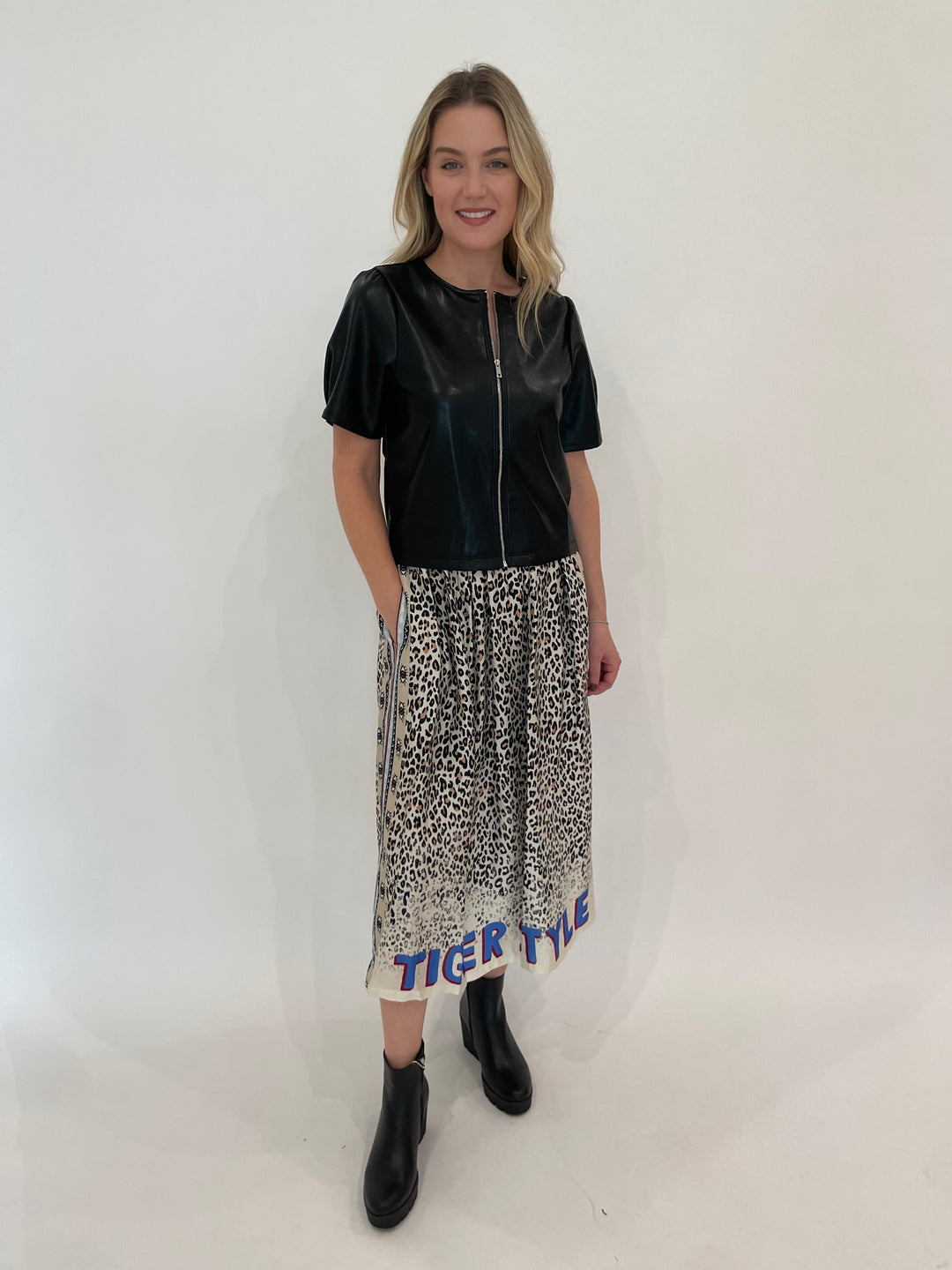 Melissa Nepton Houston Zip-Up Faux Leather Top in Black paired with ME369 Hailey Sand Printed Skirt available at Barbara Katz