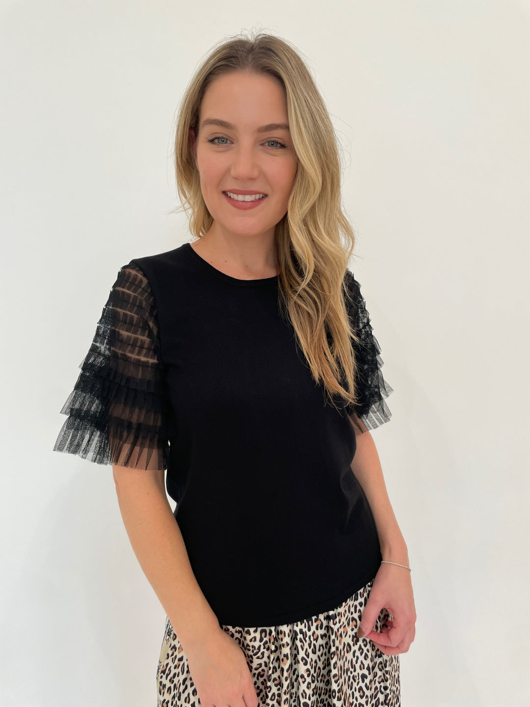 Leo & Ugo Knit Tulle Sleeve Tee in Black paired with ME369 Hayley Sand Viscose Blend Midi Skirt available at Barbara Katz