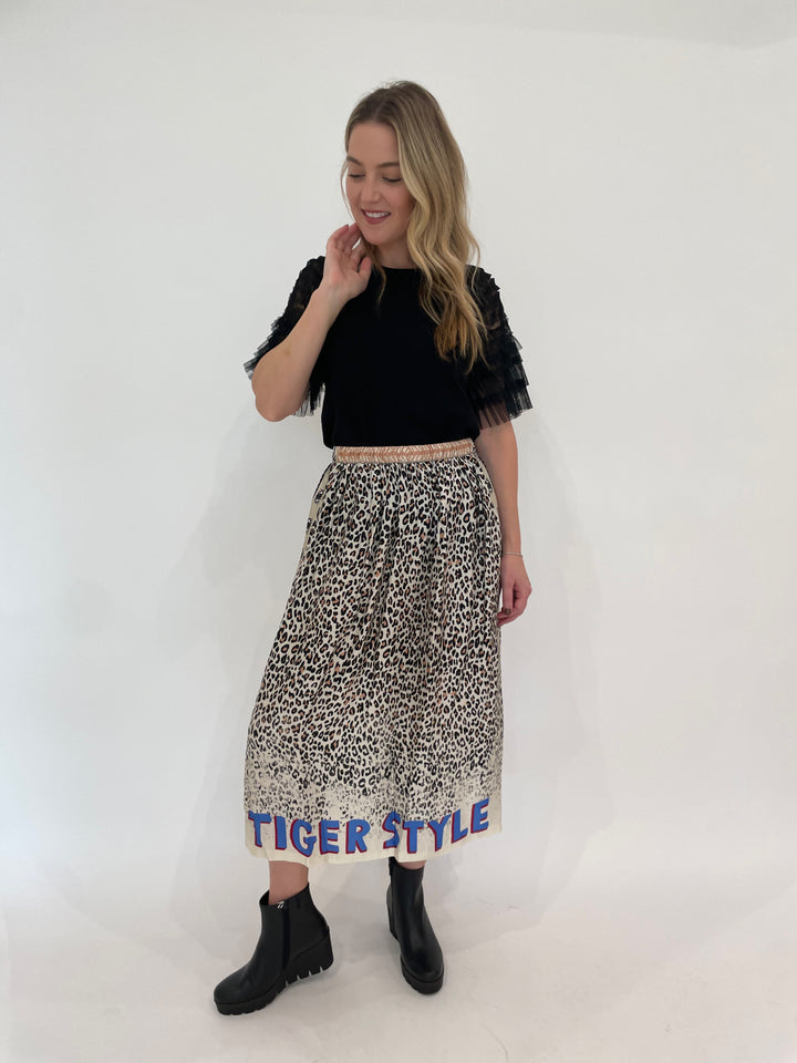 Leo & Ugo Black Knit Short Tulle Sleeve Tee paired with ME369 Hayley Sand Viscose Blend Midi Skirt available at Barbara Katz