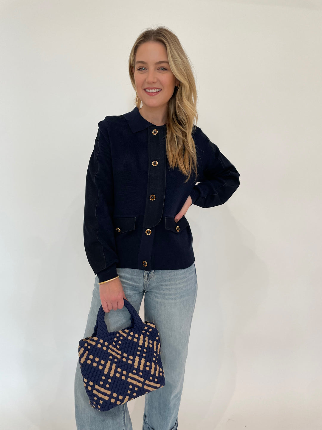 Leo & Ugo Denim Knit Jacket in Navy paired with Pistola Ryder High Rise Cuffed Jeans, Dean Davidson Gold Bleecker Statement Drop Earrings and Gold Colette Pave Bangle Bracelet, Sol and Selene Sky's The Limit Small Crossbody Bag in Navy/Nude - all available at Barbara Katz