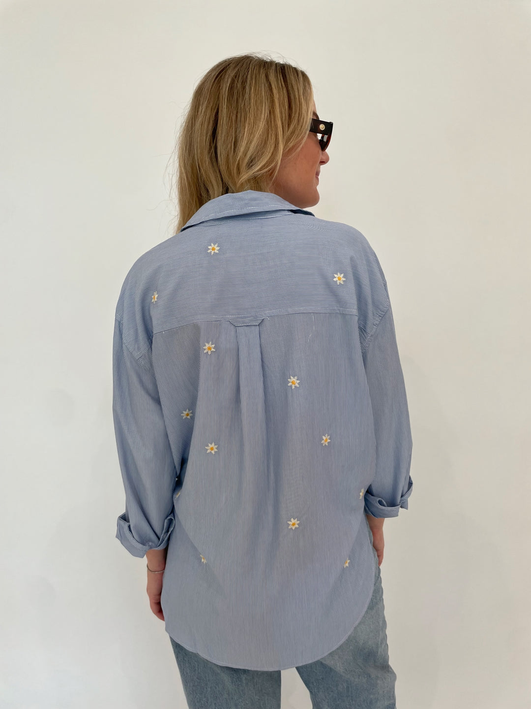 BK Fresh Flower Shirt in Blue Stripe paired with Pistola Ryder High Rise Cuffed Jeans in Essex, Le Specs Unreal! Sunglasses in Toffee Tort available at Barbara Katz