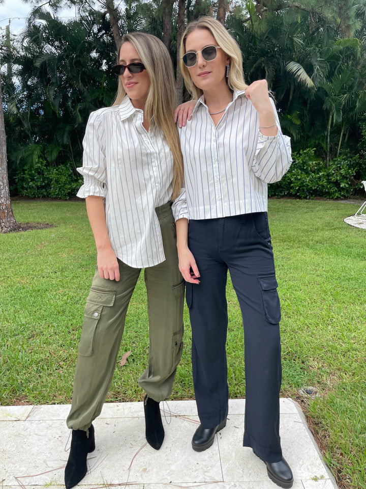 Finley Sirena Double Pinstripe Shirt in White/Green paired with Marrkech Enika Silky Cargo Pants in Pine, Finley Emmy Double Pinstripe Top in White/Blue paired with Marrakech Gavyn Cargo Pants in Black - all available at Barbara Katz