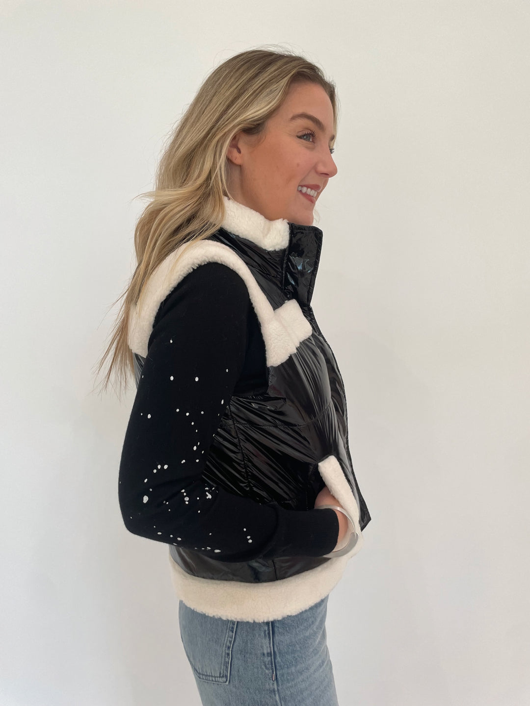 J Society Sherpa Trim Vest in Black with Black Splatter Sweatshirt underneath, Dean Davidson Crosby Hinged Bangle in Silver available at Barbara Katz