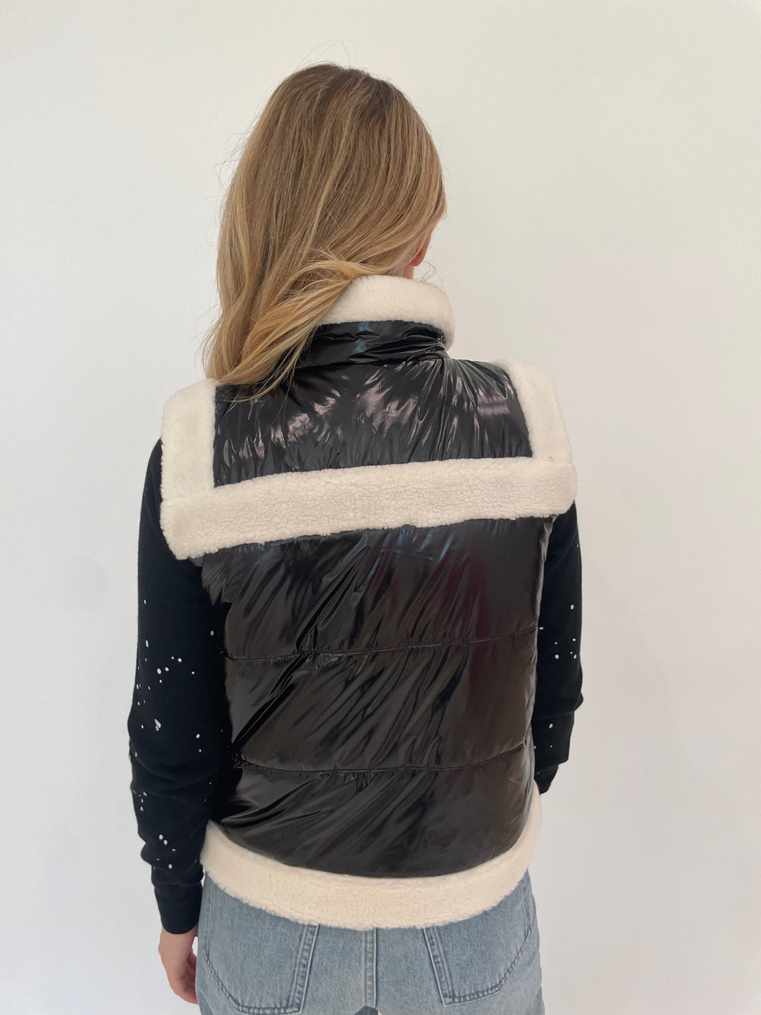 J Society Sherpa Trim Vest in Black with Black Splatter Sweatshirt underneath available at Barbara Katz