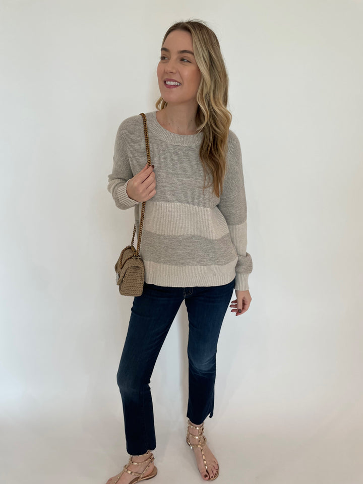 Kinross Lurex Stripe Crew Sweater in Champagne paired with Mother The Insider Crop Step Fray Jeans in Off Limits, Noam Hazan Mini Milan Bag in Stone available at Barbara Katz