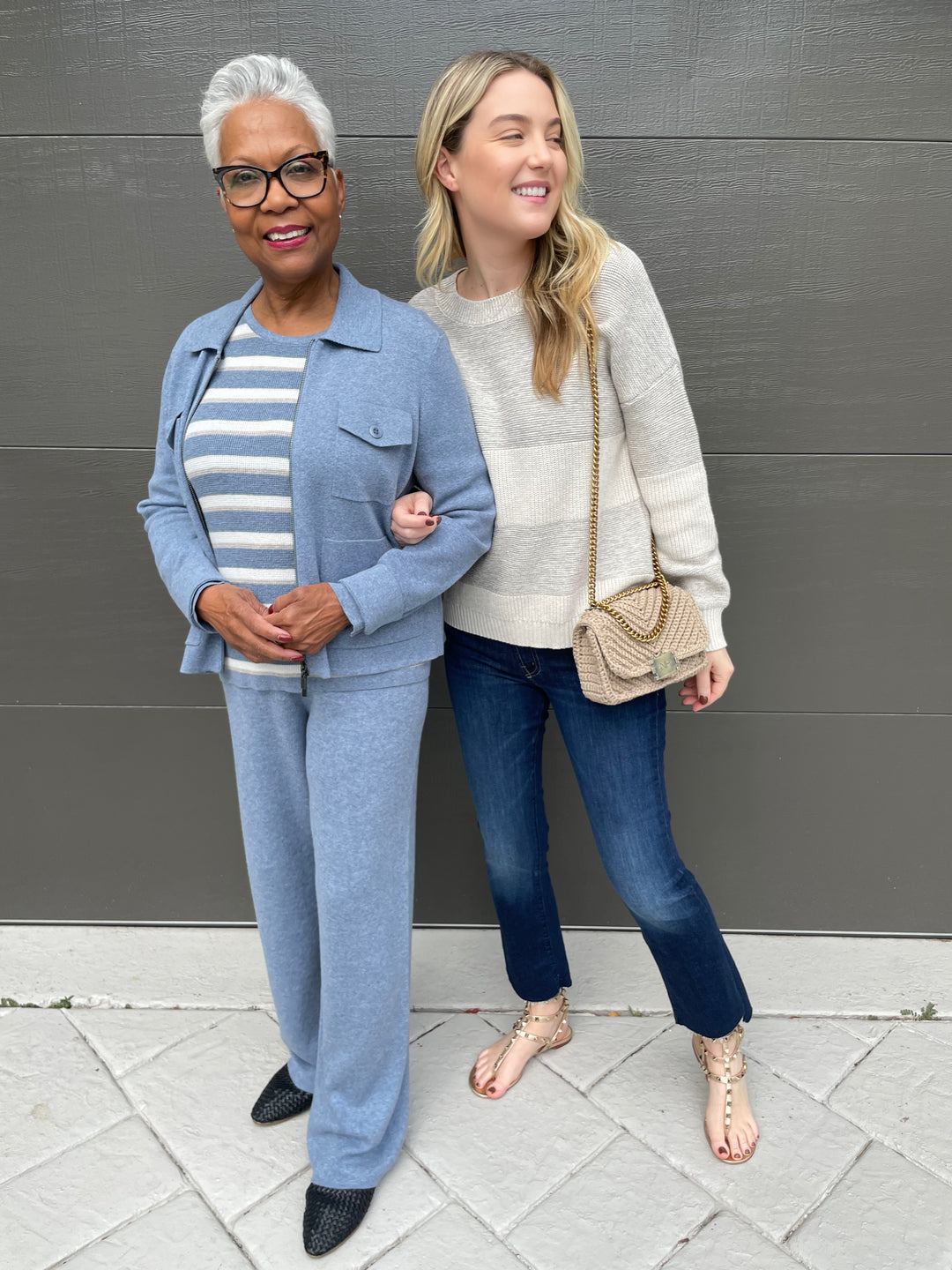 Kinross Crop Utility Cardigan in Marlin with Marlin/Ecru/Pebble Thermal Stripe Crew Sweater underneath, paired with Marlin Double Knit Pants and Kinross Lurex Stripe Crew Sweater in Champagne paired with Mother The Insider Crop Step Fray Jeans in Off Limits, Noam Hazan Mini Milan Bag in Stone available at Barbara Katz