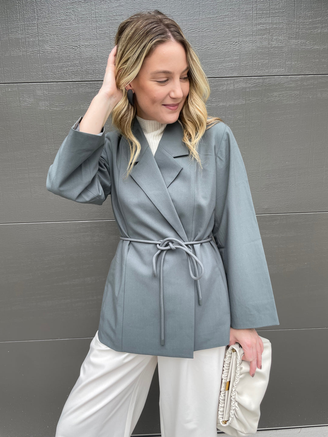 Lilla P. Notch Collar Blazer in Slate paired with Wide Leg Pull-On Pants in Winter White, DeMellier Miami Clutch in Off White, Pono Ice Christie Earrings in Shadow available at Barbara Katz