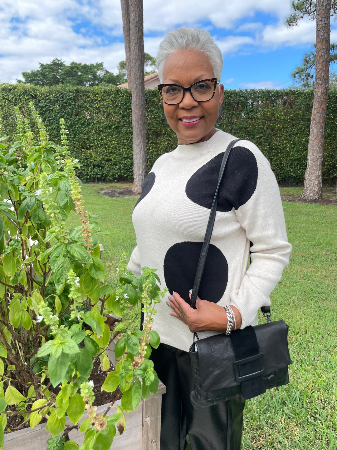 Oui Dannie Dotted Pullover Sweater in Off White/Black paired with Lysse Amara Straight Flare Vegan Leather Pants in Black Wicker, Daniella Lehavi Eva Clutch Bag in Black Croco available at Barbara Katz