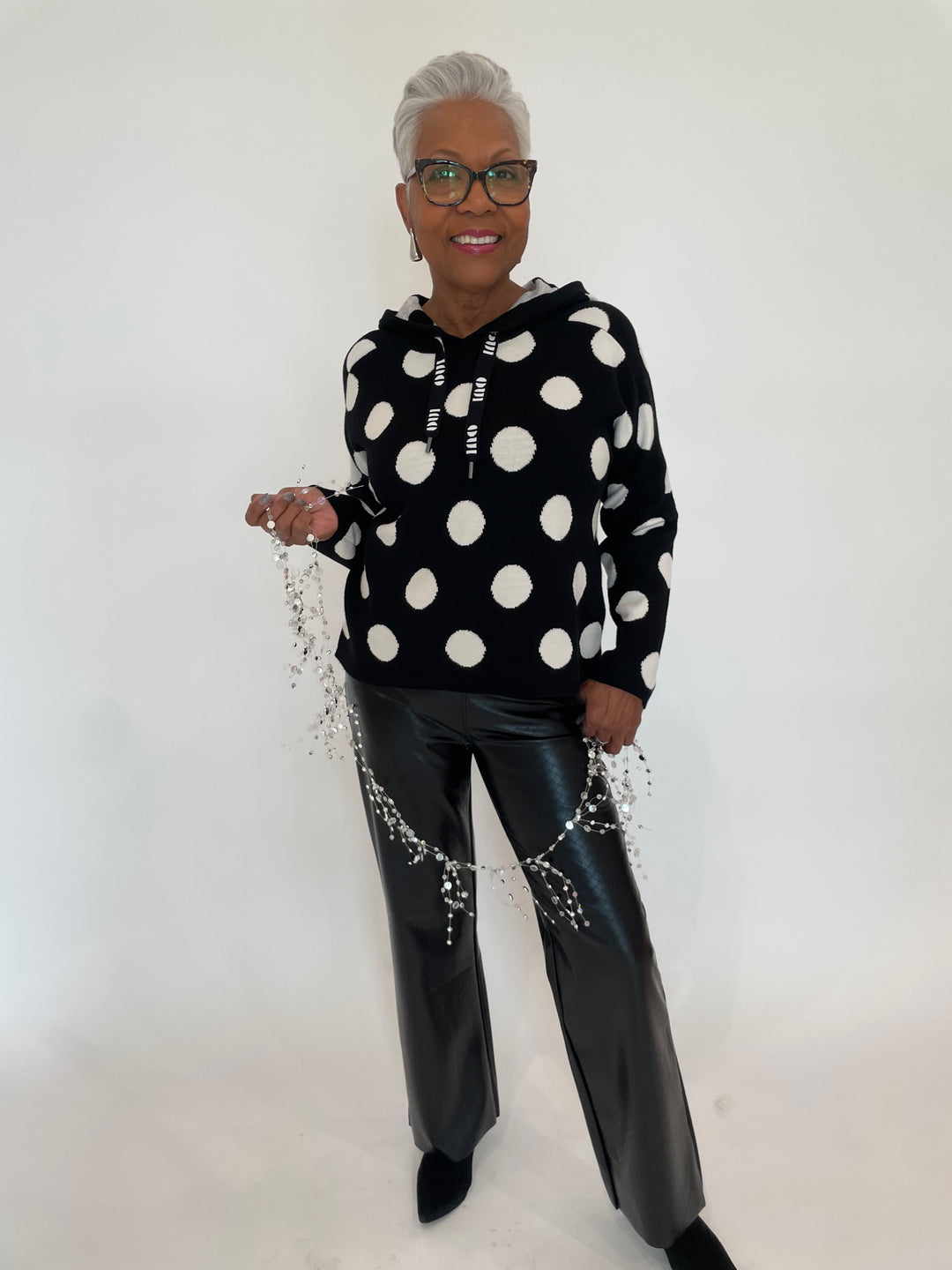 Oui Rosie Small Dotted Hoodie Sweater  in Black/Off White paired with Amara Straight Flare Vegan Leather Pants in Black Wicker available at Barbara Katz