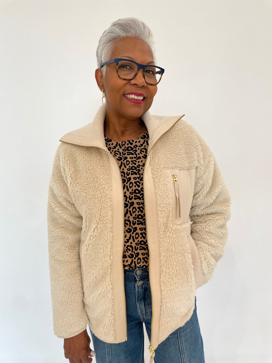 Varley Myla Zip-Through Jacket in Sandshell with Edinburgh Knitwear Leopard Print Crew Sweater underneath, paired with Pistola Jadyn Low Slung Palazzo Jeans in Celebration available at Barbara Katz