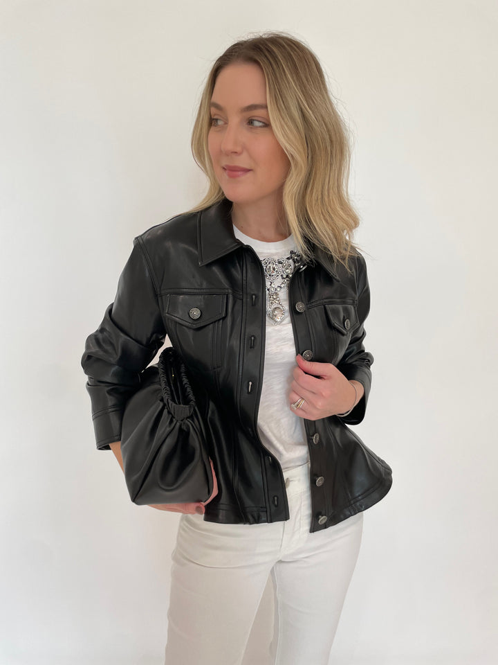 Cinq a Sept Applique Jewelry Tee in White paired with MAC Dream Wide Wonderlight Jeans 32" in White Denim, Cinq a Sept Gina Faux Leather Jacket in Black and DeMellier Miami Clutch in Black - all available at Barbara Katz