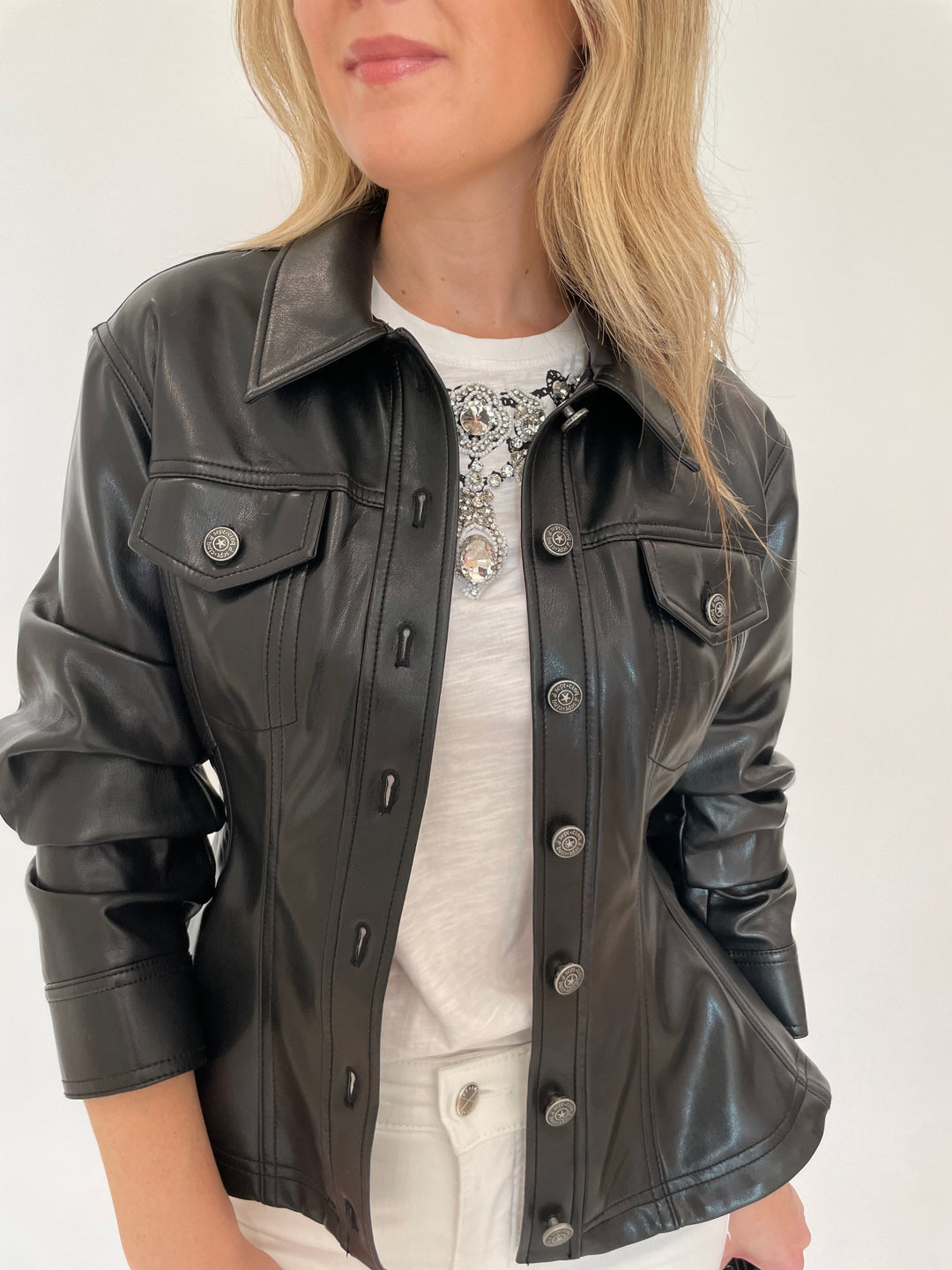 Cinq a Sept Gina Faux Leather Peplum Jacket in Black with Applique Jewelry Tee underneath available at Barbara Katz